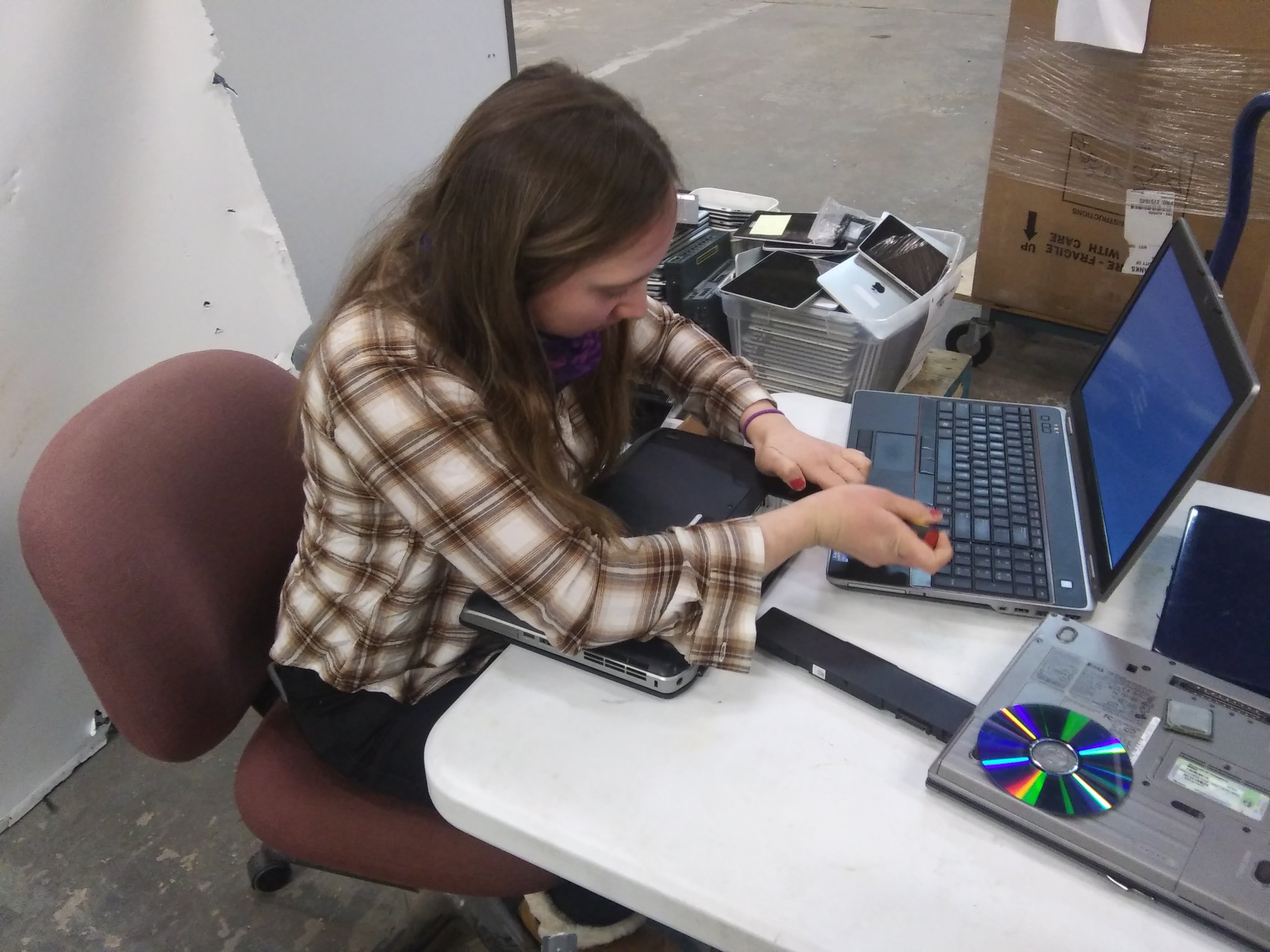 Volunteer working on a laptop